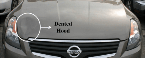grey Nissan car damage